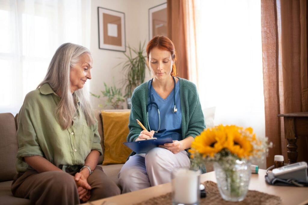 Nurse cosulting with senior her health condition.